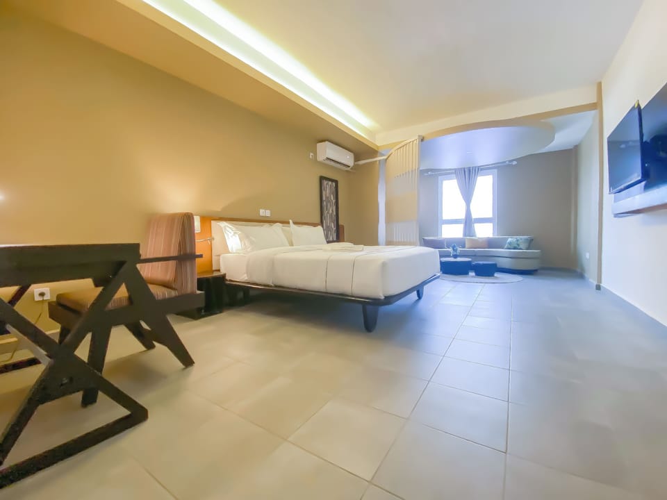Junior Suite, Pool View | In-room safe, soundproofing, iron/ironing board, free WiFi