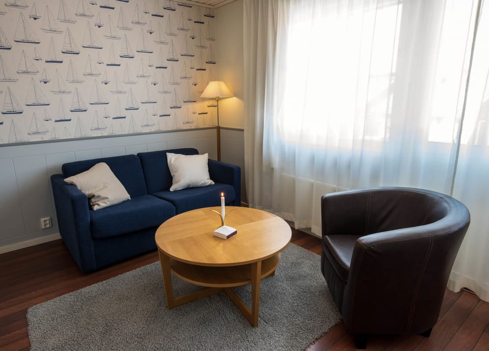 Family Room | Desk, iron/ironing board, cribs/infant beds, bed sheets