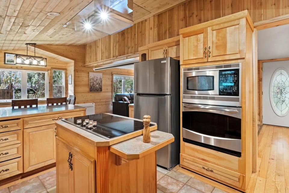 Cook together in a warm cabin kitchen made for memories.