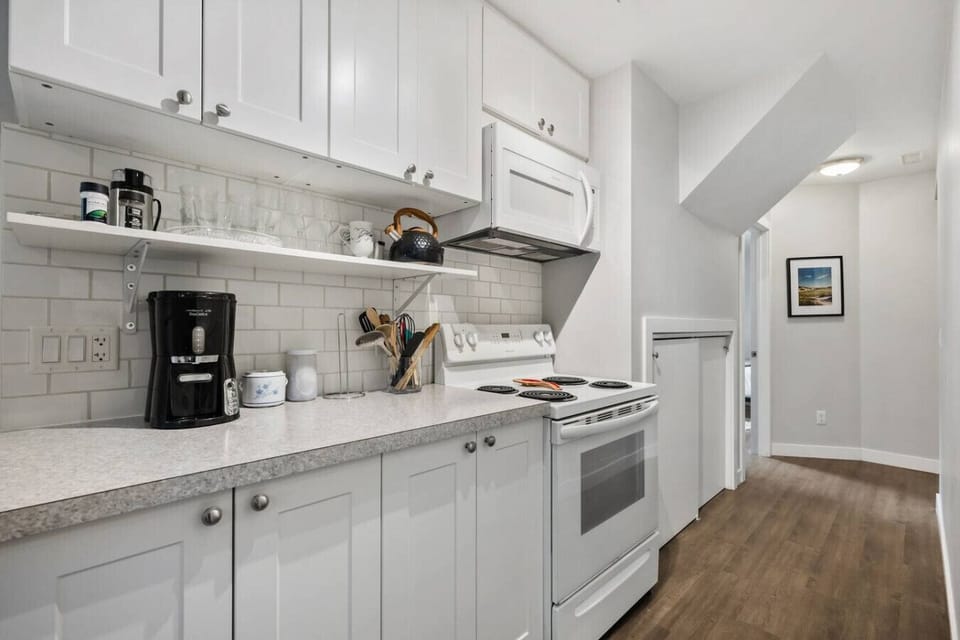 Full kitchen with a crockpot/slow cooker, drip coffee machine, ground coffee, tea and sugar. Please note there isn`t a dishwasher in this unit.