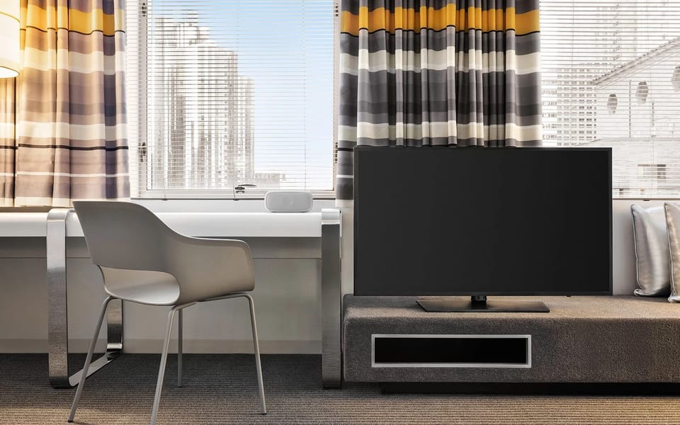 Settle in with flat-screen entertainment and a dedicated workspace.