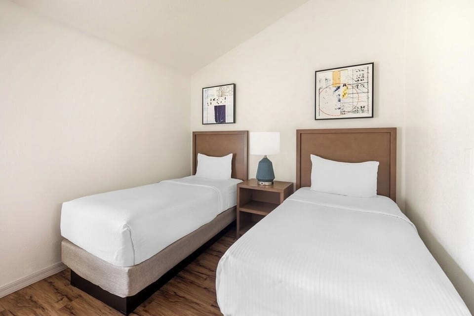 Unwind in crisp twin beds for restful, quiet nights.