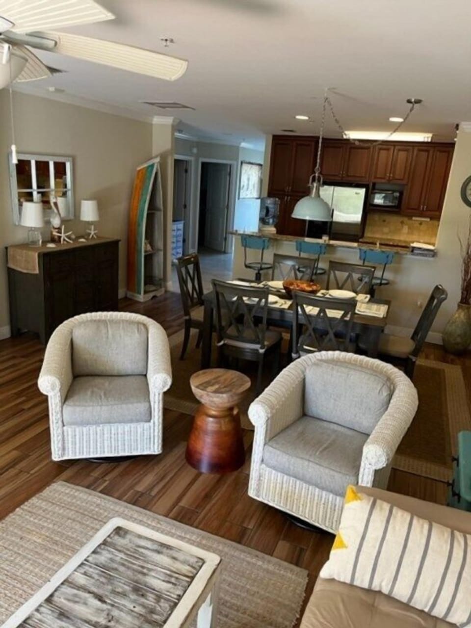 Open-plan living area with cozy seating and a dining space, perfect for family gatherings.