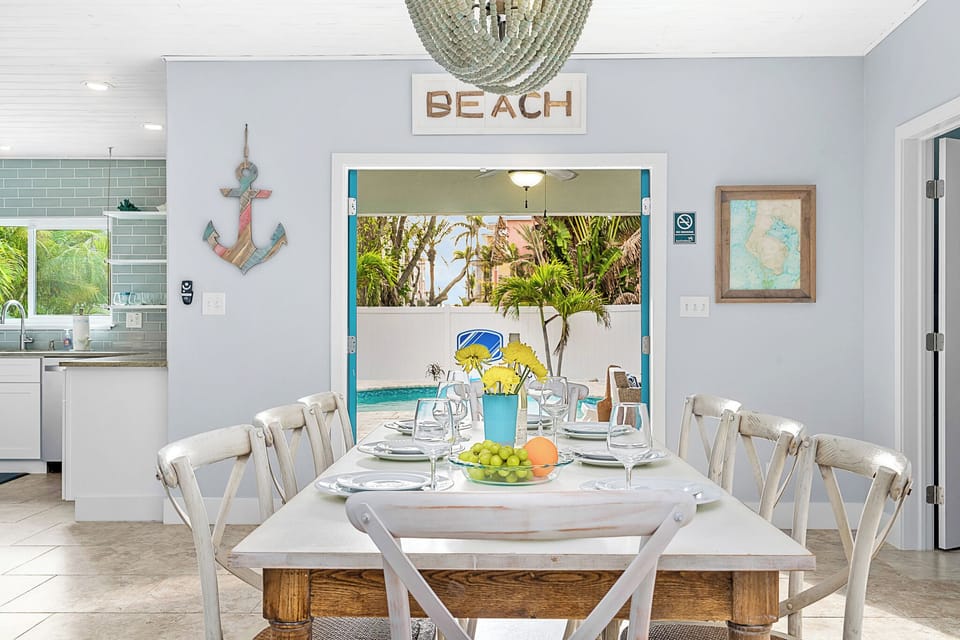 Dine in paradise—seating for 8 with poolside coastal views.