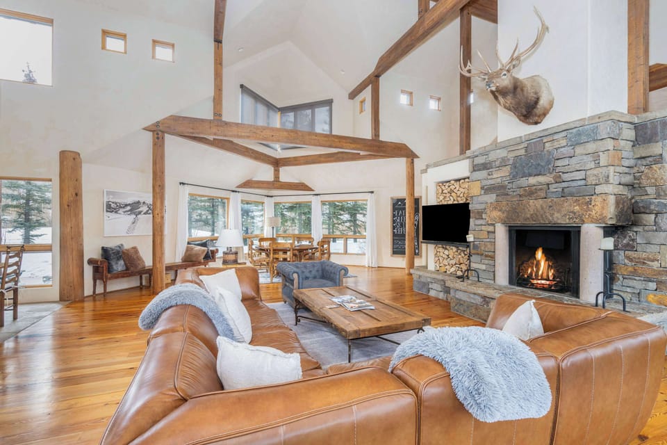 Living room: Main floor, gas fireplace, 55" Samsung Smart TV, vaulted ceilings, radiant heating no A/C, patio access