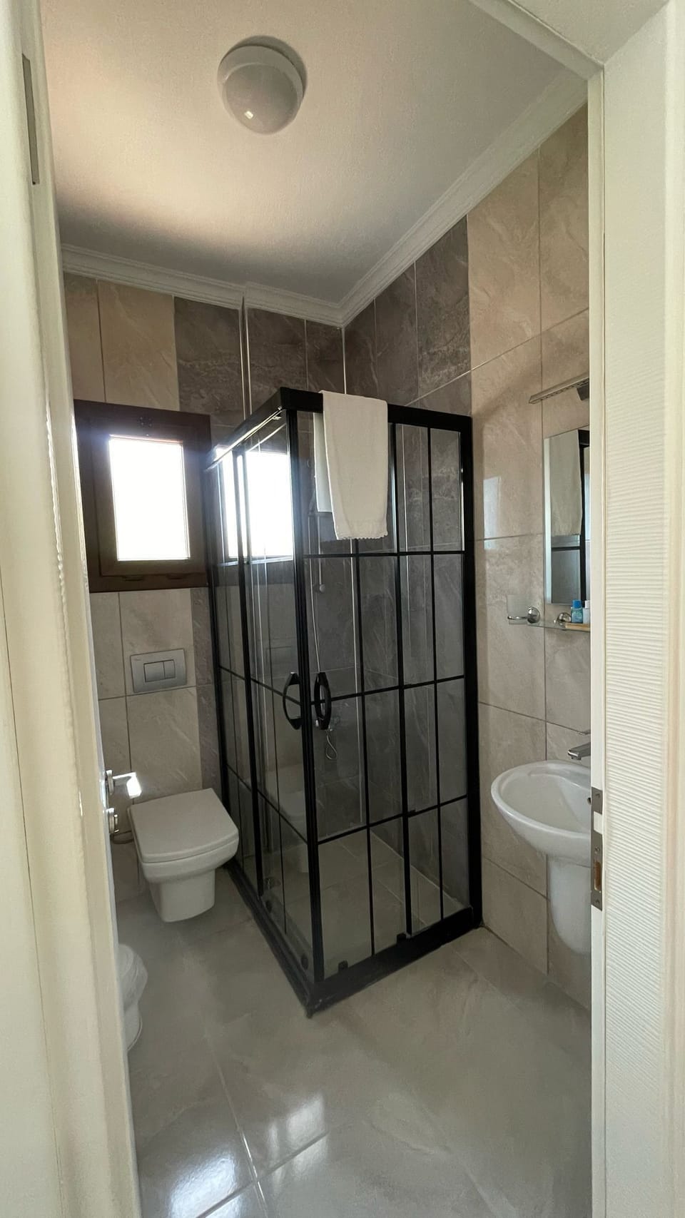 Double Room, Partial Sea View | Bathroom | Shower, hair dryer, towels, soap