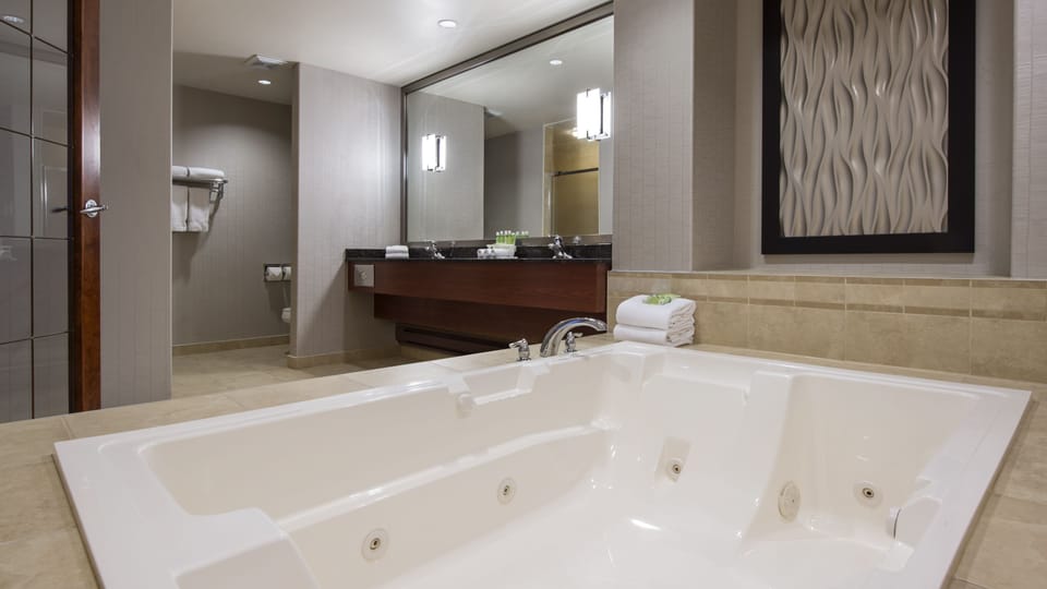 Suite, 1 King Bed (Additional Living Area) | Bathroom | Combined shower/tub, free toiletries, hair dryer, towels