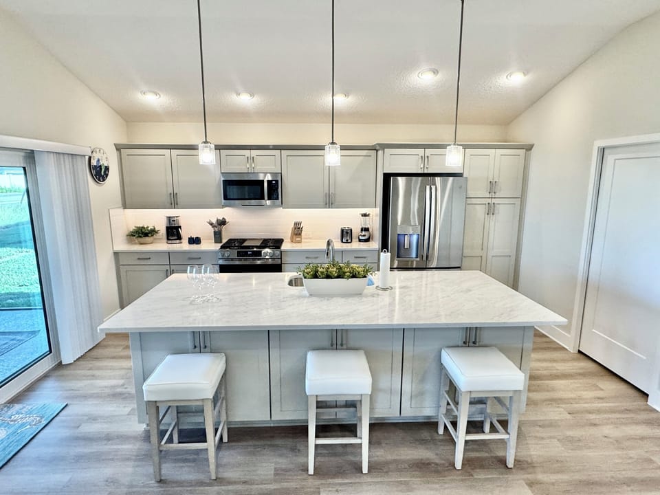 Modern, Fully Equipped Kitchen with Utility Room to the Right