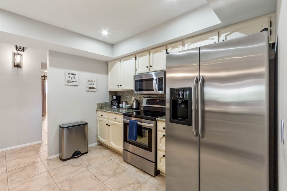 Stainless steel appliances, ample counter space, and a large island.