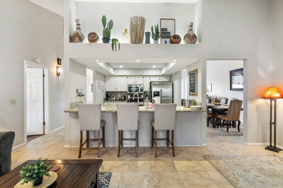 Stainless steel appliances, ample counter space, and a  island with counter stool seating for three (3).