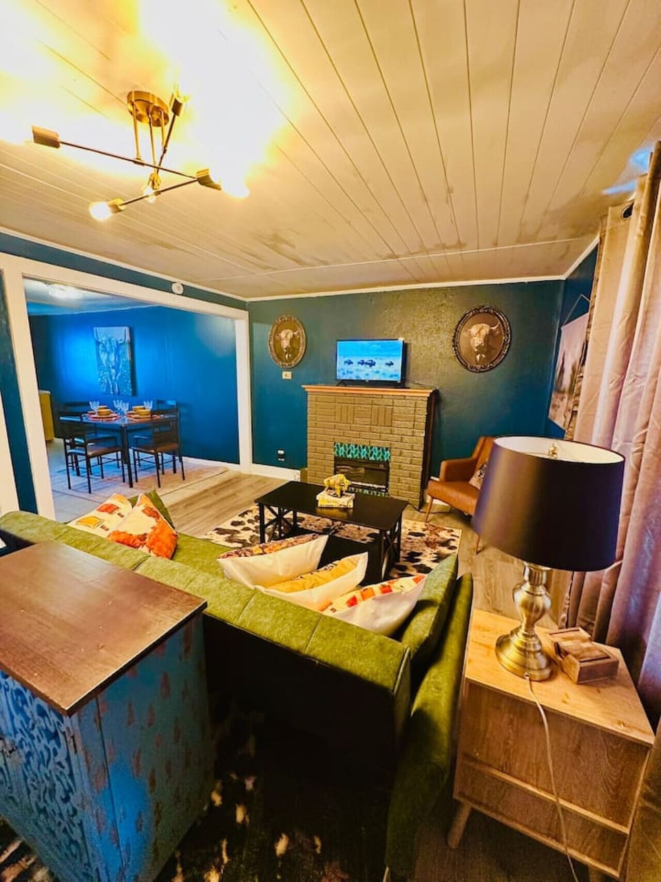 Gather around the hearth and enjoy a movie night under warm golden tones and buffalo gazes.
