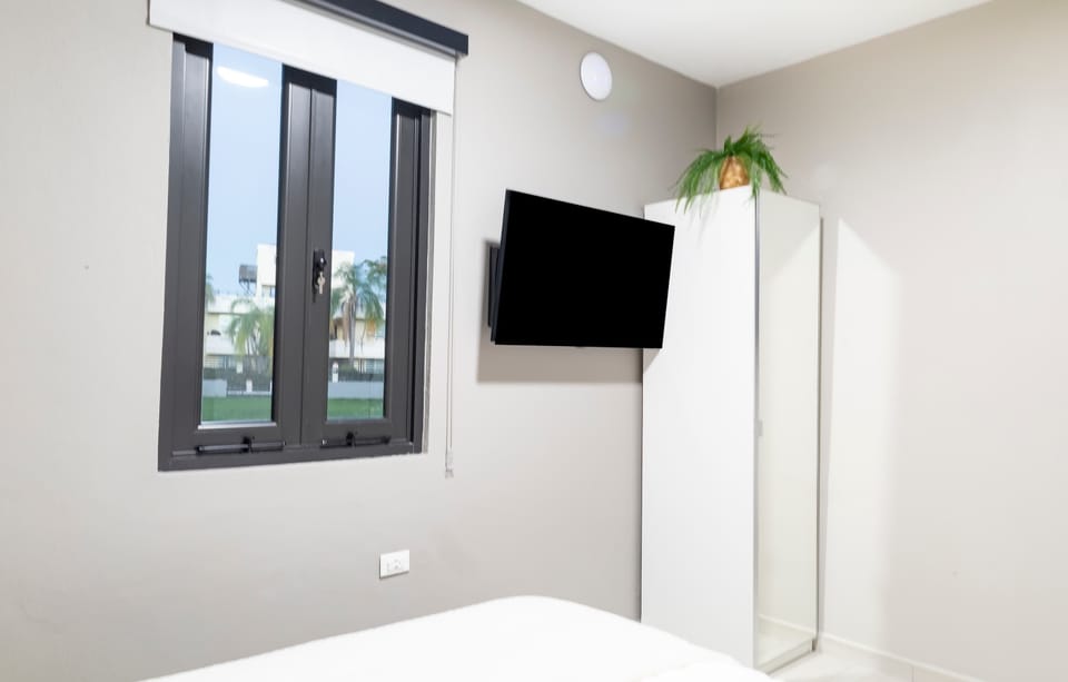 Bedroom with Queen Bed, TV & Cabinet
