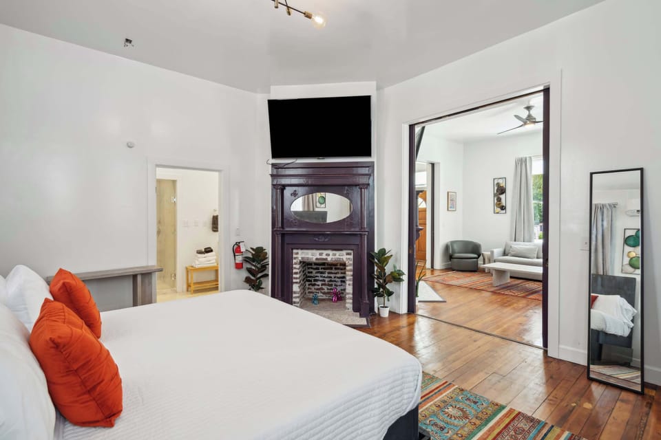 spacious bedroom with king bed and en suite bathroom