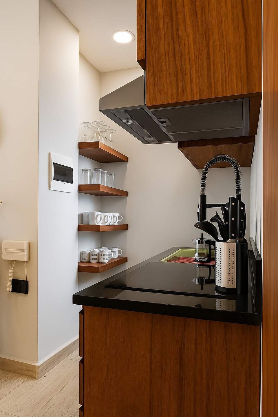 "Boho-Modern Kitchen with All Essentials – Equipped with open wood shelving, glassware, dishware, and modern appliances for cooking, coffee-making, and everyday living."