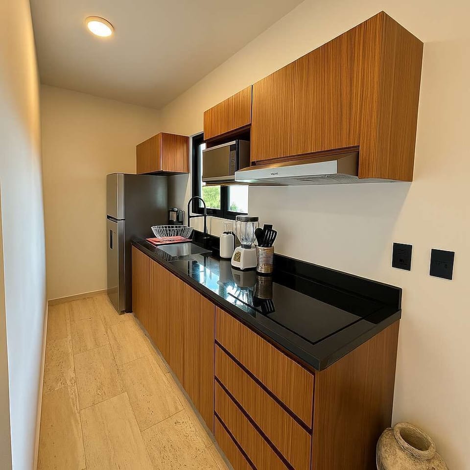 Kitchen 
Modern, clean, and fully equipped — this kitchen makes it easy to prepare fresh meals, smoothies, or your favorite morning coffee. Designed for long stays, short escapes, and everything in between.

