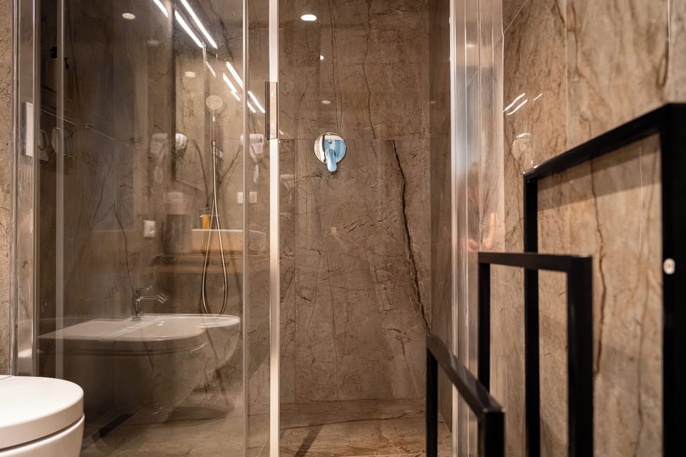 Superior Triple Room | Bathroom | Shower, hair dryer, towels, soap