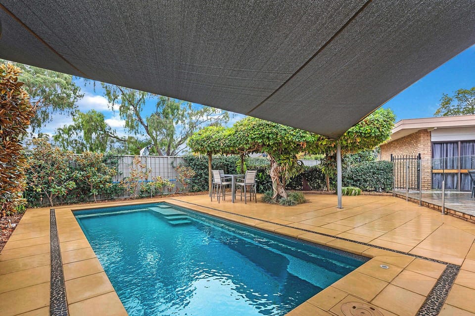 Pool area with shade sail