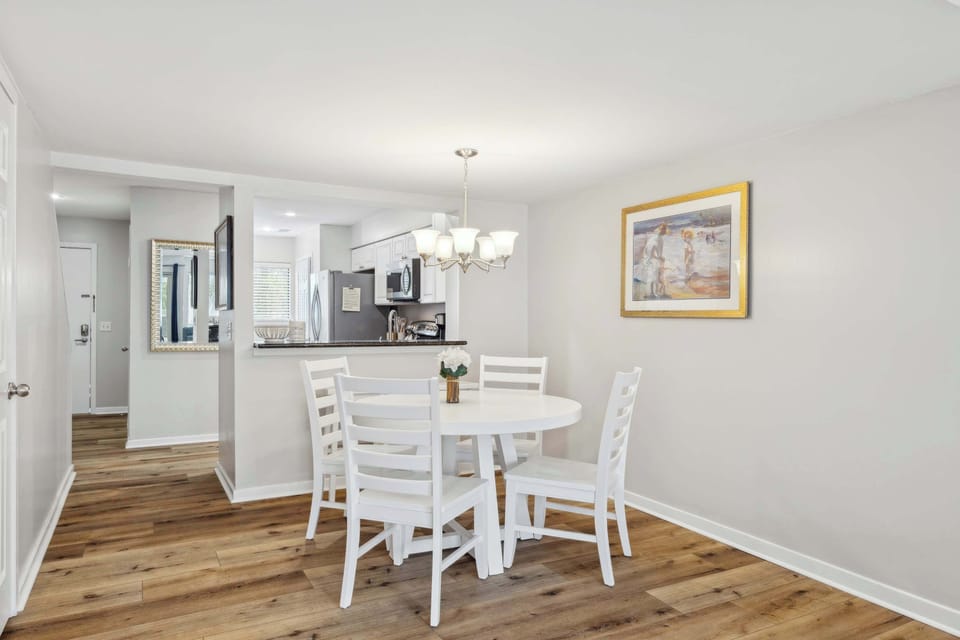 Dining area with table and seating for 4 