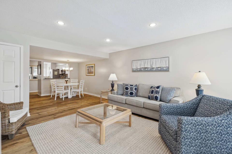 Bright living area with sofa sleeper, and Smart TV