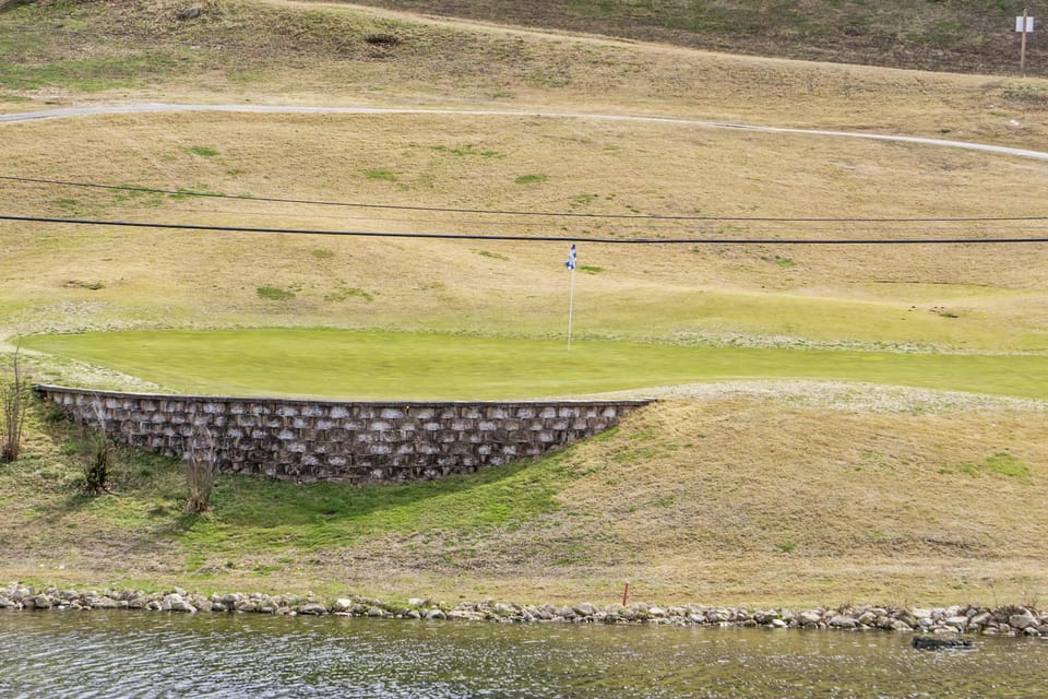Sip your morning coffee in the sunroom with water & golf course views