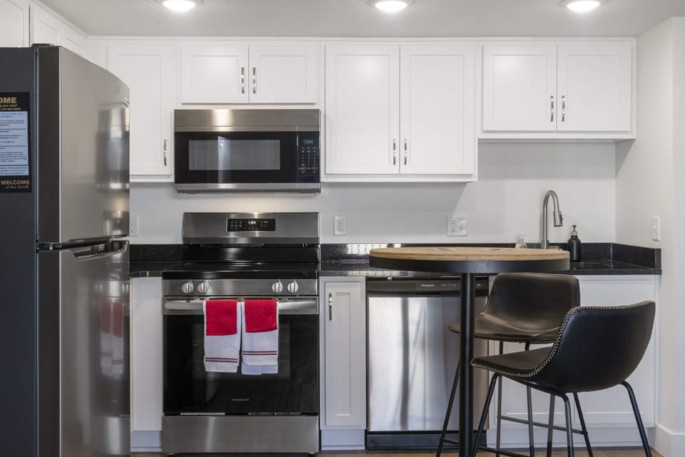 The airy eat-in kitchen offers ample storage & every home comfort
