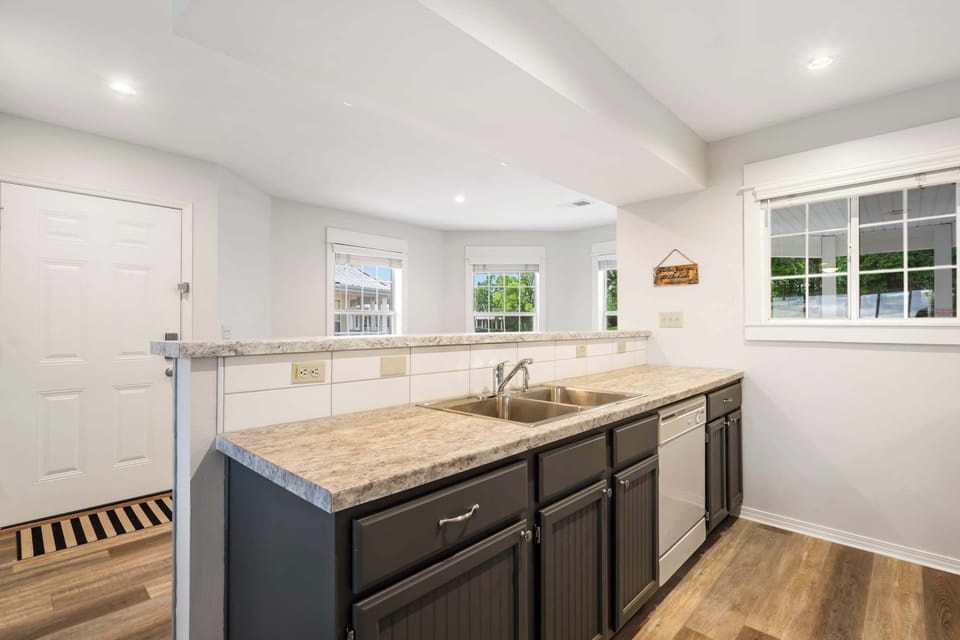 The open, airy kitchen offers ample space & every home comfort