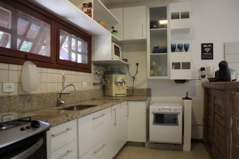 Villa | Private kitchen | Fridge, microwave, oven, stovetop