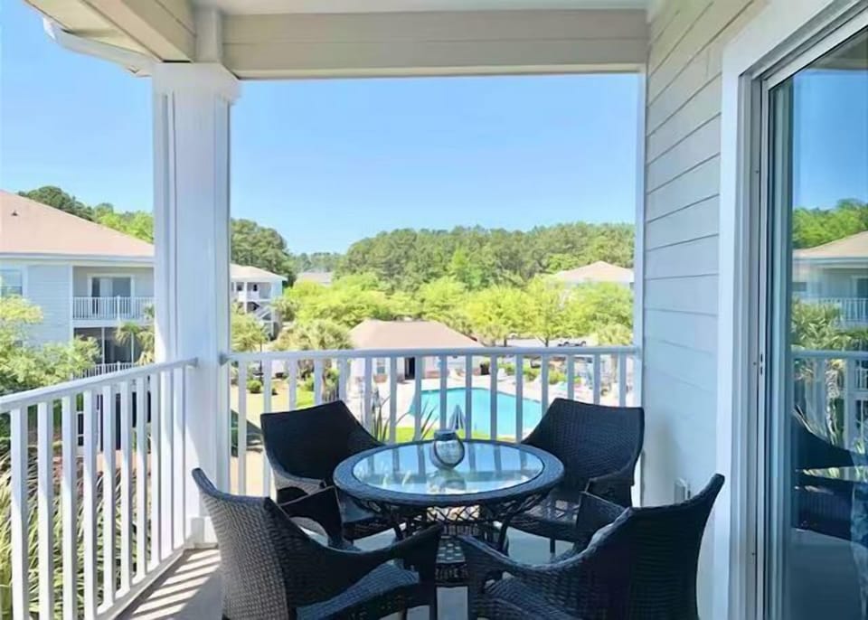Balcony Sitting Area with View of Pool
