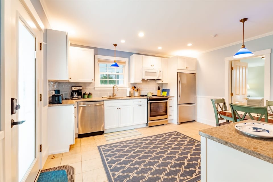 Fully stocked kitchen with stainless steel appliances