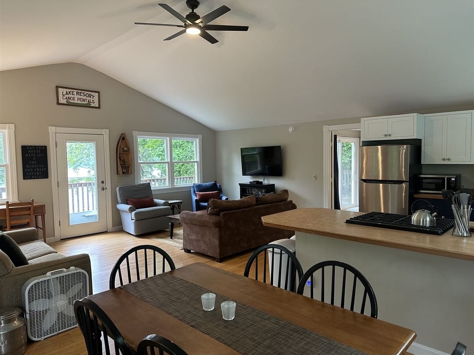 The main living area with kitchen, dining table and comfortable seating