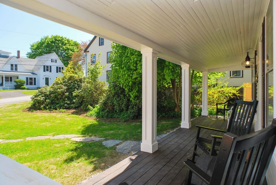 The covered porch is a great place to relax and enjoy morning coffee or evening cocktails