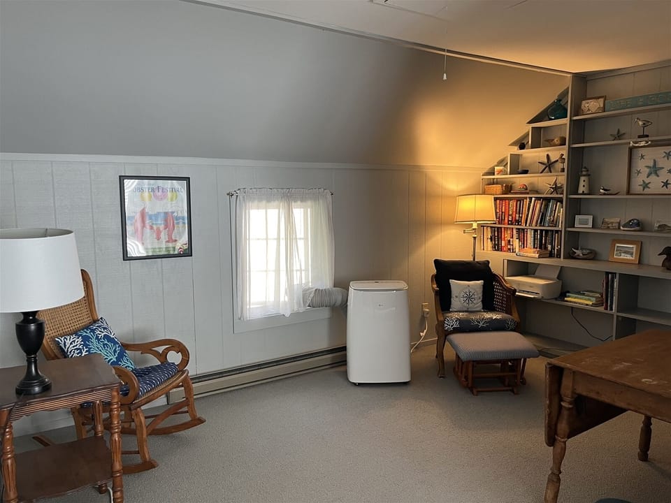 Second floor sitting area attached to queen bedroom