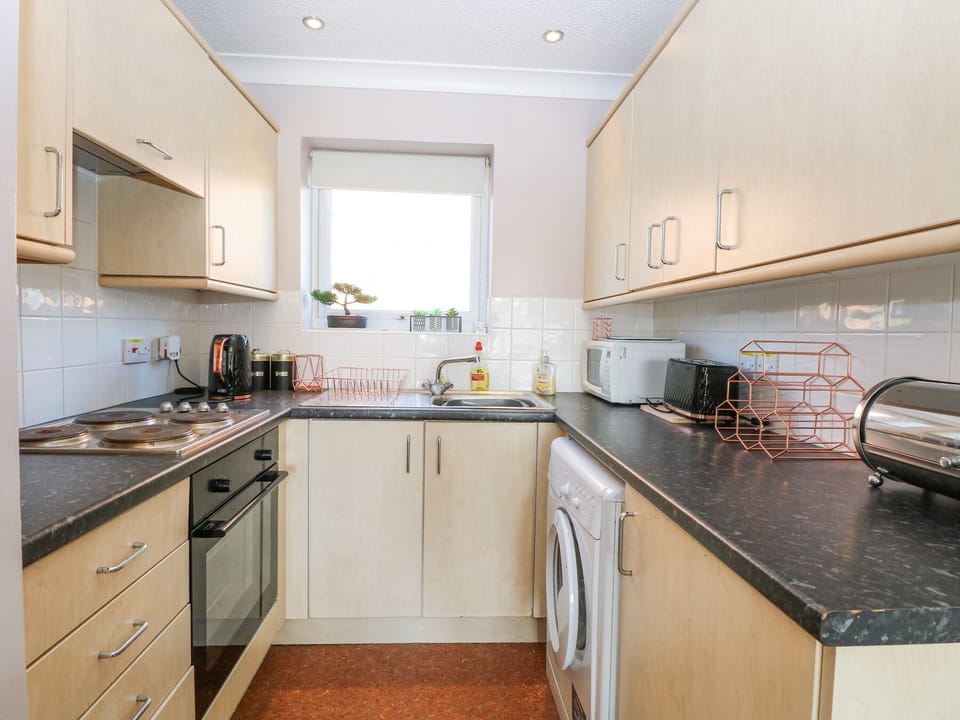Fridge, microwave, toaster, cookware/dishes/utensils
