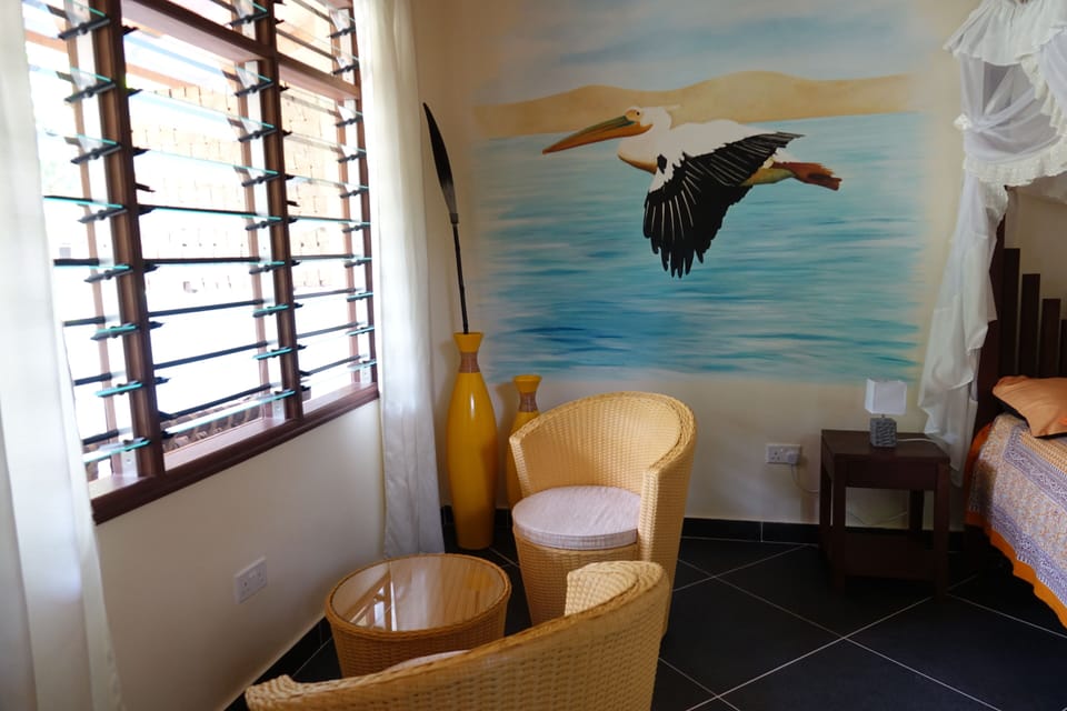 Deluxe Studio Suite, Garden View | In-room safe, desk, laptop workspace, blackout drapes
