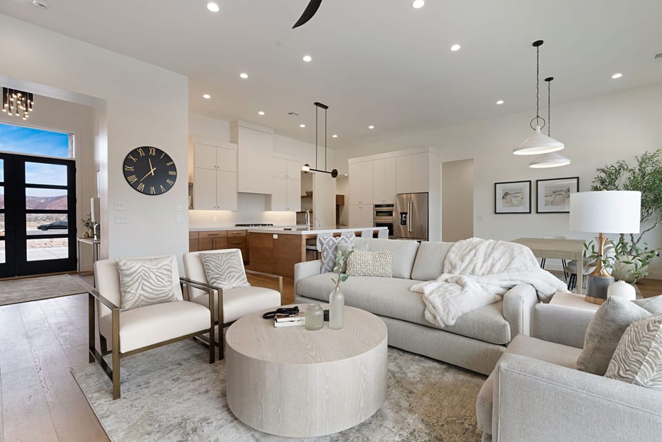Gather, unwind, and connect in this light-filled open living space—perfect for morning coffee or cozy nights in.