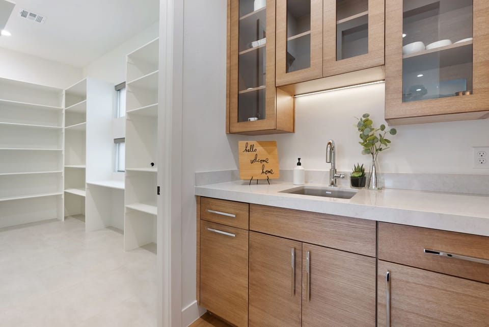 The butler's pantry and large connected walk in pantry offer an abundance of storage space