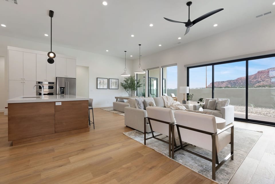 The spacious and open floor seamlessly blends the living room, dining area, and kitchen, making gathering with friends and family easy and convenient.