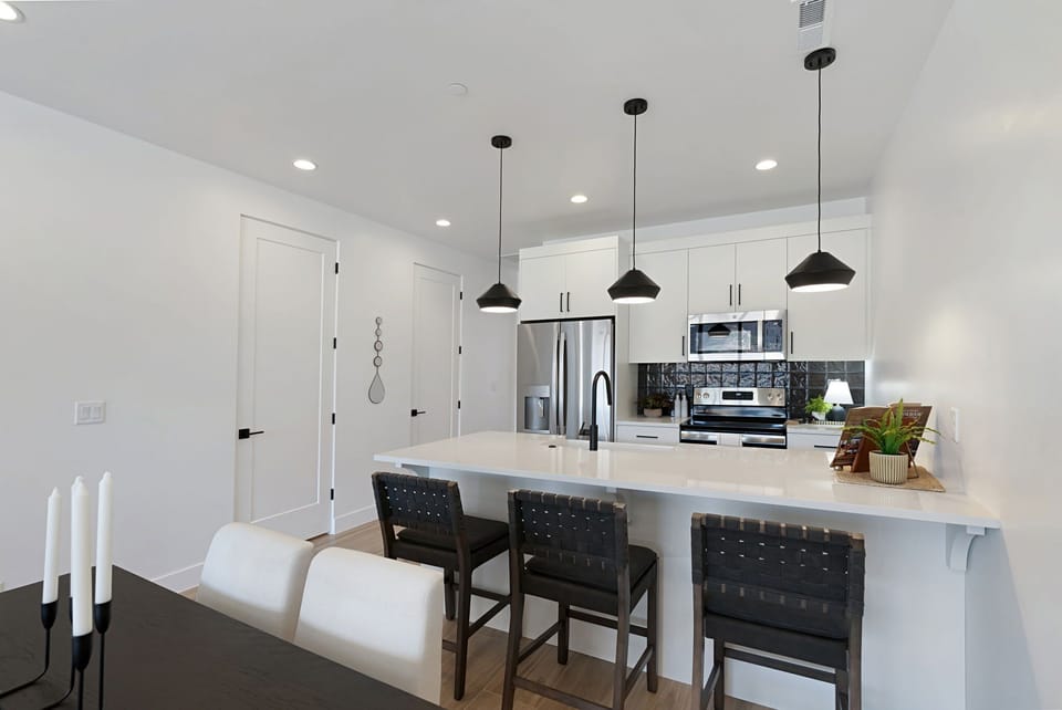 A fully appointed kitchen with extra seating at the bar make cooking up your favorite meals easy and fun at Iron I-1!