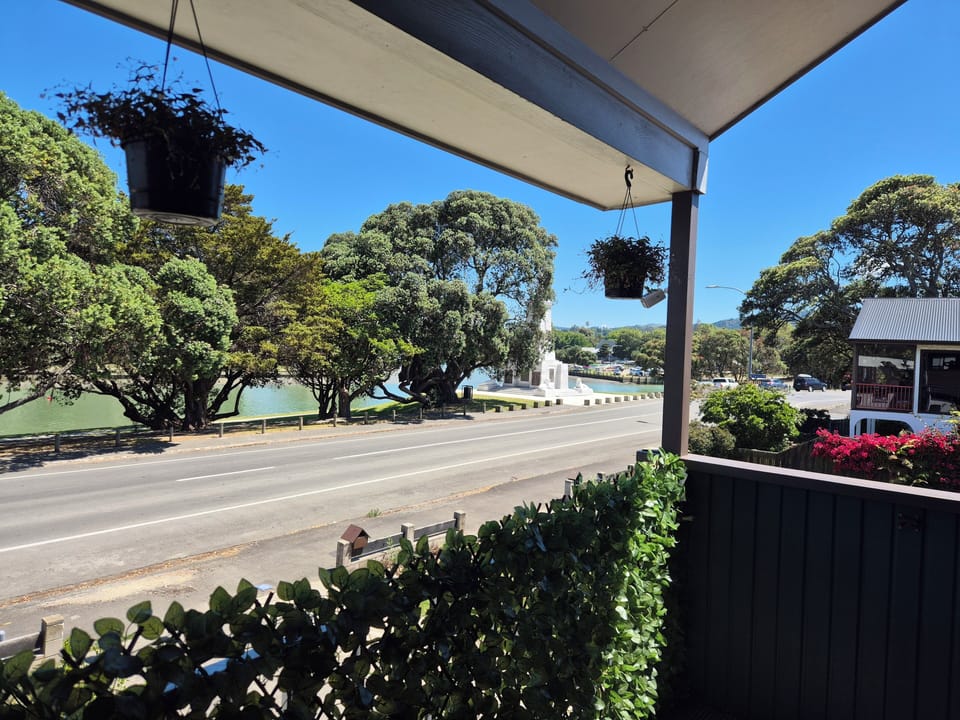 Relax on the verandah and watch waka ama paddlers