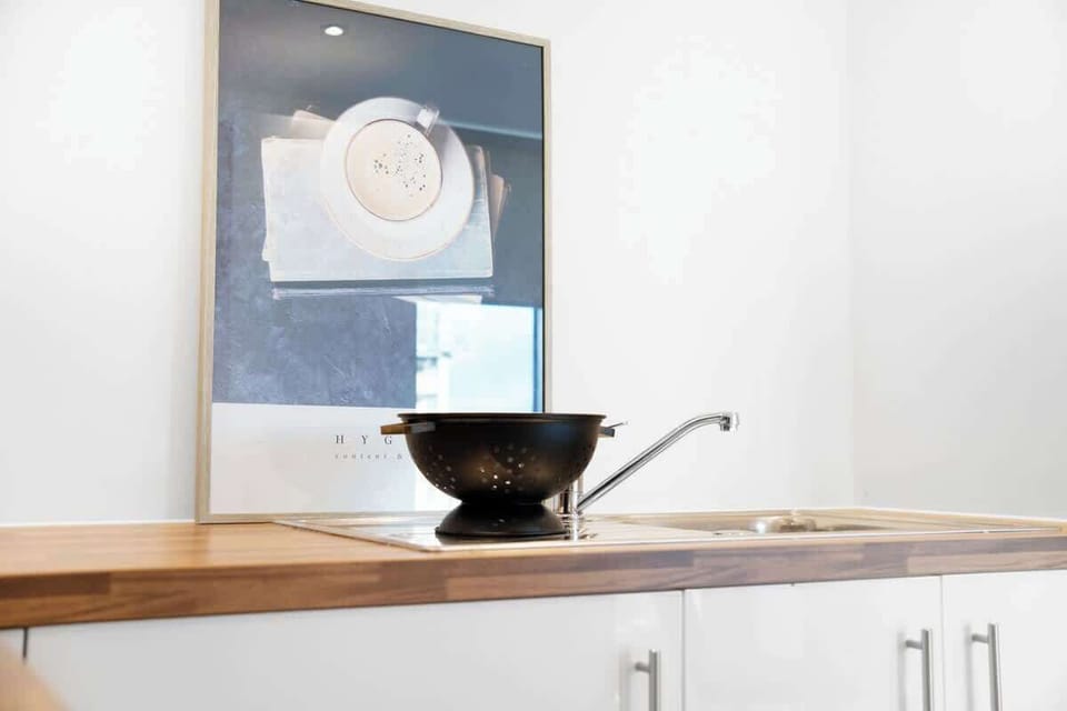 Kitchen equipped with all essentials, including, oven, fridge and full cookware set.