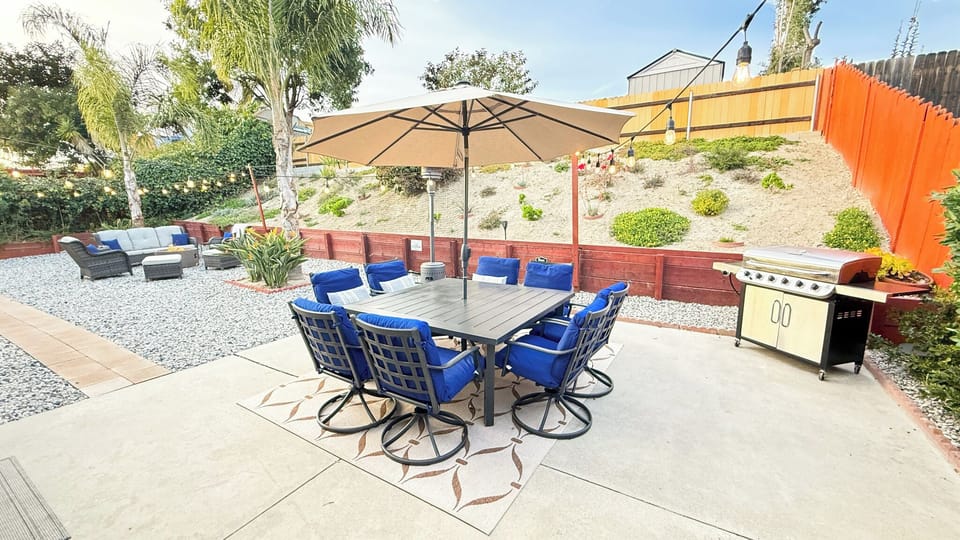 Outdoor dining seating for 8, relaxing fire pit, and grill to enjoy the summer. 