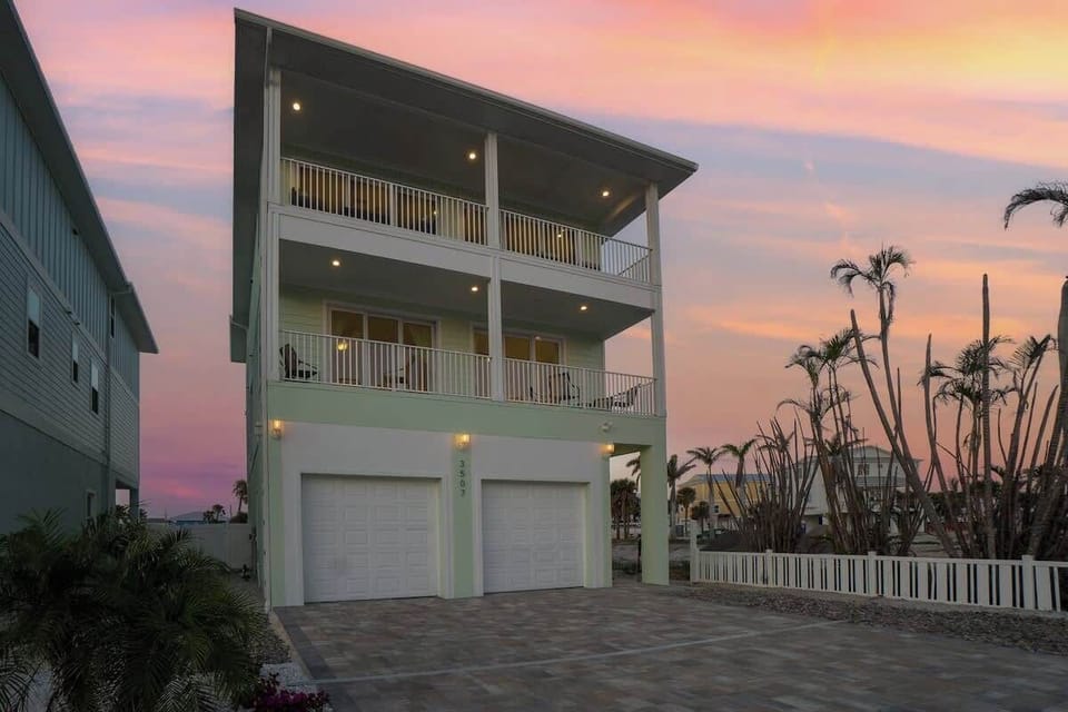 Built in 2024 this 3 story home sits on Estero Blvd. and has a beautiful view of the the Gulf