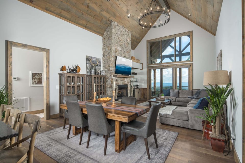 Dining table with seating for eight beside the living room and kitchen