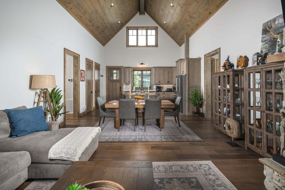 Open-concept main level connecting the living room, dining area, and kitchen