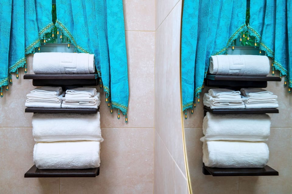Fresh towels await! Enjoy our well-stocked bathroom amenities.