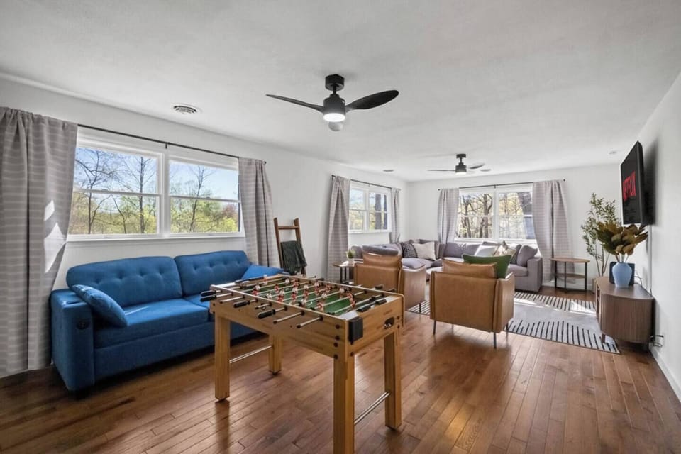 Queen sleeper sofa, foosball, large sectional, and a 65” Smart TV, ceiling fans, and a lot of natural light! 