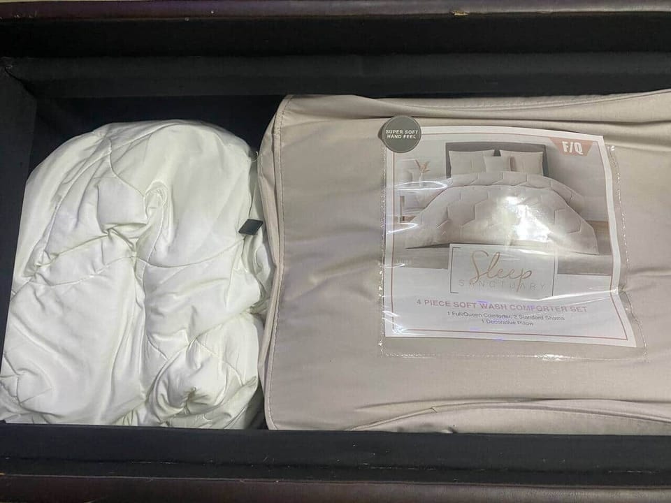 This private room/ sleeping area has a Smart TV , board games a table and four chairs, a mini fridge and a convertible table to play pool, ping pong , foosball or air hockey. The couch is a pull out and bedding and pillows are inside the ottoman.