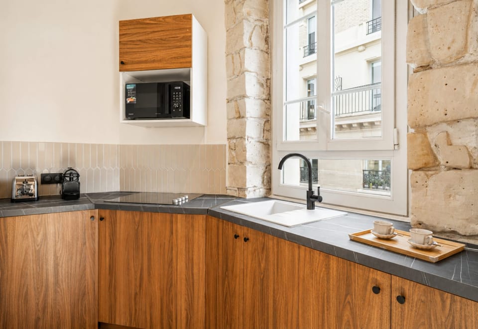 A convenient brand new bathroom featuring a shower, fresh towels, and a welcome kit of essentials.