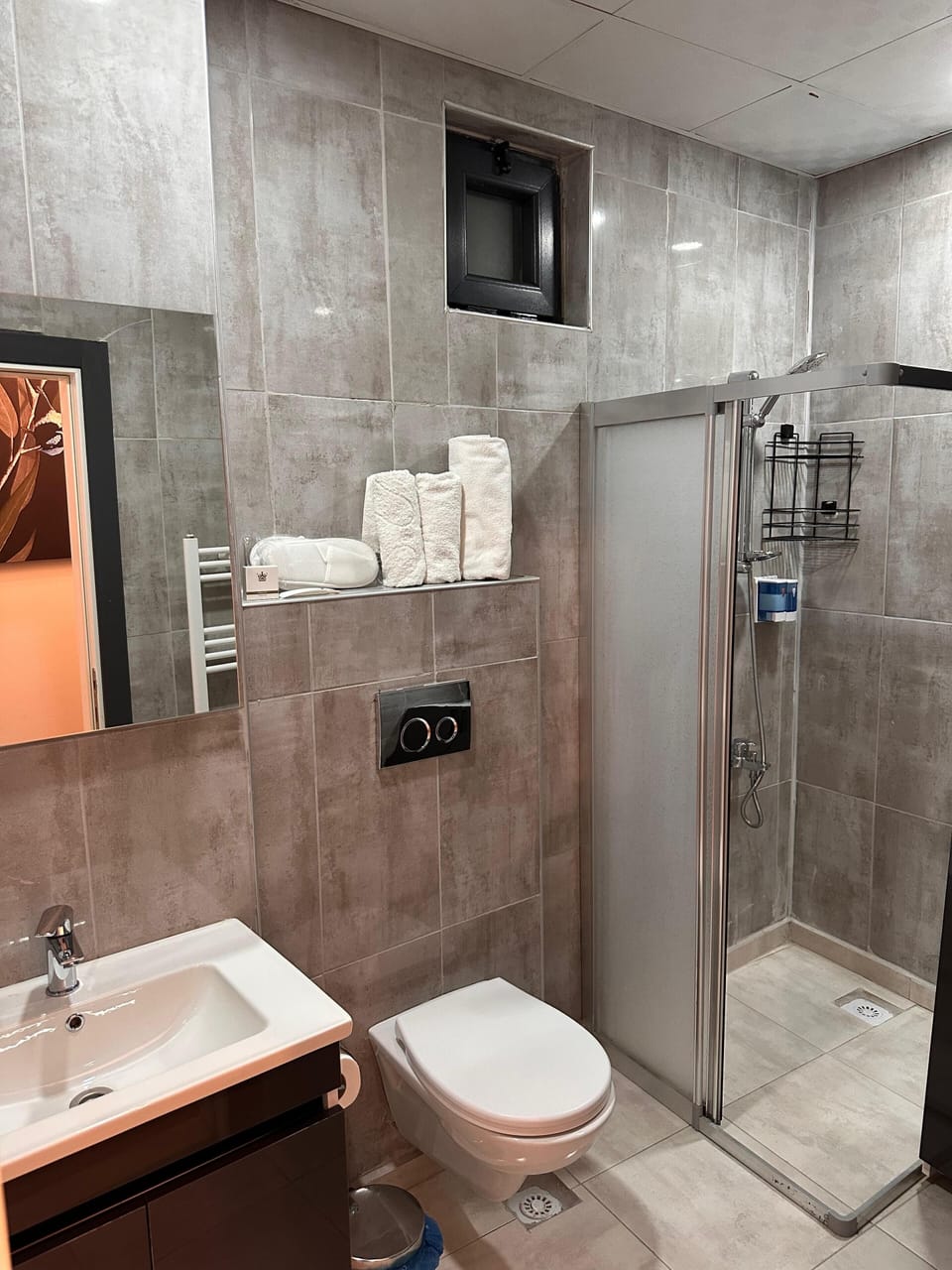 Shower, hair dryer, slippers, towels