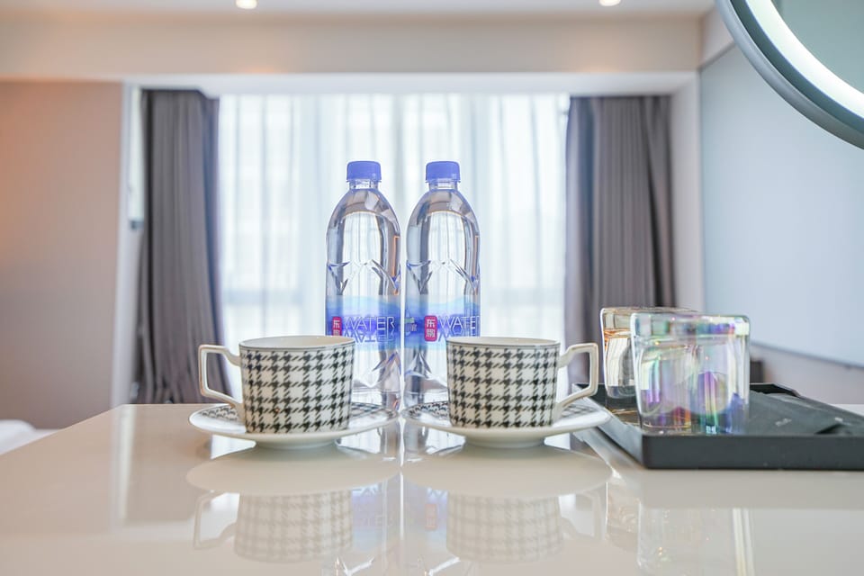Elite Room, 1 King Bed, Refrigerator, River View | Bathroom | Separate tub and shower, hydromassage showerhead, designer toiletries
